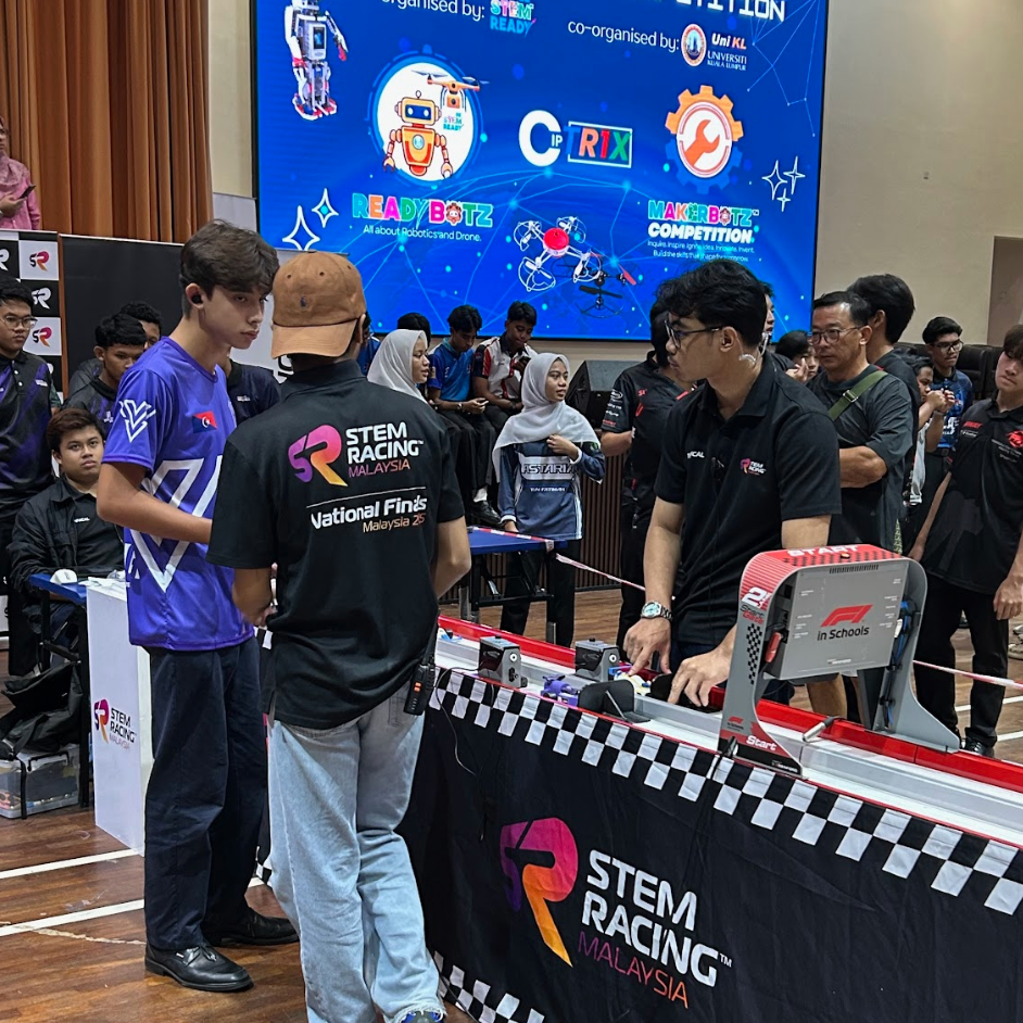 Trackside moment with officials and the STEM Racing stage